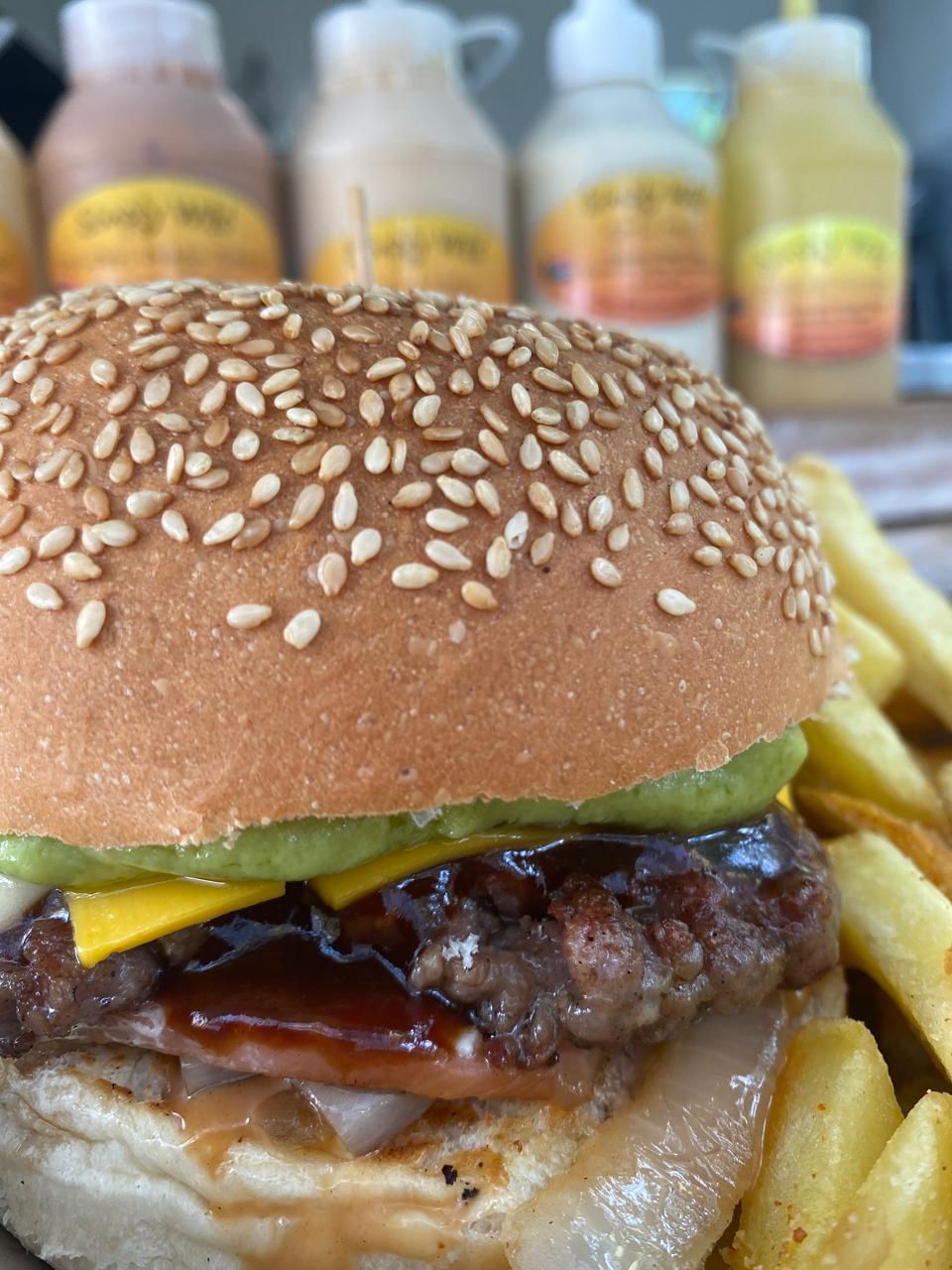 Burger with fries and sauces